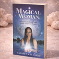 Book titled 'Magical Woman' on a wooden surface with a mystical background